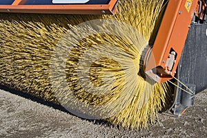 Rotating industrial brush of a street cleaning tractor