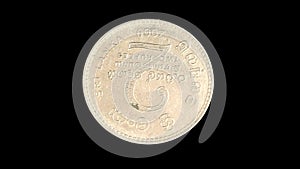 Rotating obverse of Sri Lanka coin 2 rupees 2009 with Sinhalese and Tamial inscriptions meaning TWO RUPEES SRI LANKA.