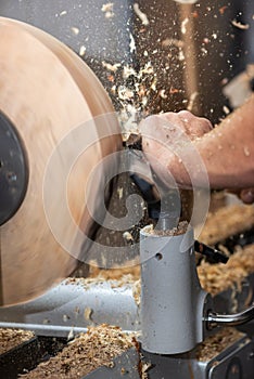 Rotating piece of wood and fyling sawdust