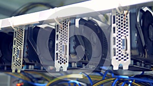 Rotating reels of graphic cards during cryptocurrency mining