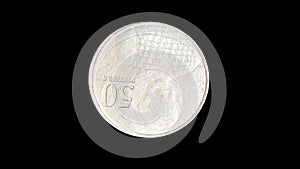 Rotating reverse of Ghana coin 50 pesewas 2007. Isolated with black background.