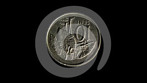 Rotating reverse of Samoa coin 10 sene with image of taro plant. Isolated in white background.