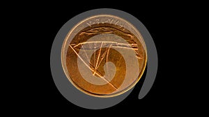 Rotating reverse of United Arab Emirates coin 10 fils 1988. Isolated in black background.