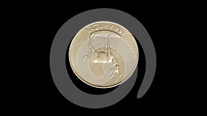 Rotating reverse of United Arab Emirates coin 25 fils with image of a gazelle. Isolated in black background.