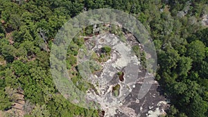 Rotating shot over 40 Acre Rock in Kershaw, SC with large bird flying beneath camera and over rock