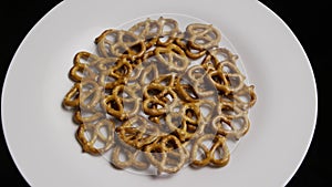 Rotating Shot Of Pretzels On A White Plate