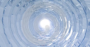 A rotating silver metal chrome shiny tunnel with walls of ribs and lines in the form of a circle with reflections of luminous rays