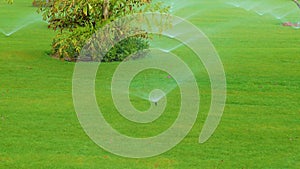 Rotating sprinkler over lawn irrigation device