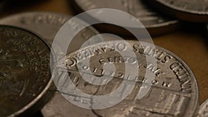 Rotating stock footage shot of American nickles (coin - $0.05)