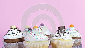 Rotating testy sweet cup cakes served on the plate