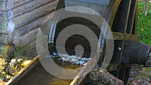 Rotating wheel of an old wooden mill close-up. Bugrovo, Pushkinsky Gory. Russia
