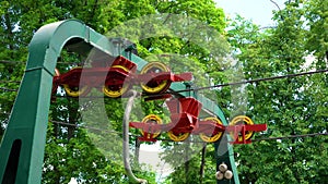 Rotating wheels and reinforced metal cables of funicular mechanism in city park