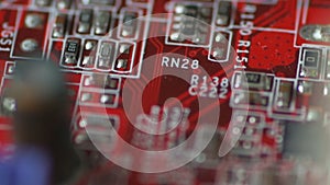 Rotation of a bright red board for microcircuits with chips and diodes