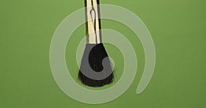 Rotation of a cosmetic brush on a green screen. Cosmetic brush.