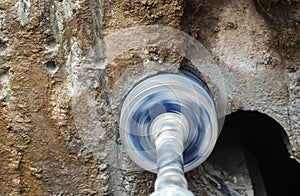 Rotation diamond drilling holes in concrete wall pipe