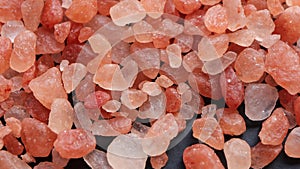 Rotation of raw Himalayan pink salt crystals.natural coarse Himalayan salt crystals.