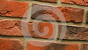 Rotation of red decorative brick with cracks. Brickwork background. Figure block