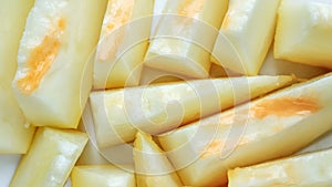 Rotation of slices of ripe honey melon, top view