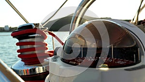 Rotation Of Spherical Yacht Compass On Board A Sailboat Making Turn Near Rocky Coast