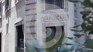 Rotation view of the building, where barberâ€™s shop is located, in a small Italian city. No people around. Italian