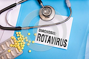 Rotavirus word written on medical blue folder with patient files
