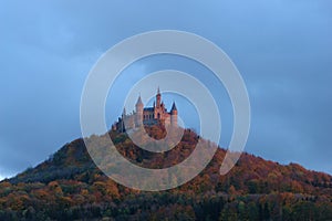 A red castle on the mountain photo