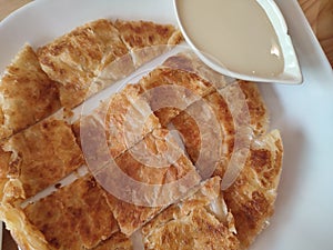 Rotee in pieces serve on white dish.