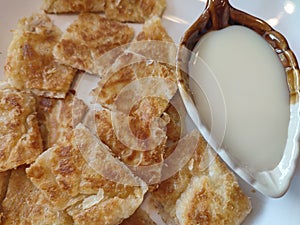 Rotee in pieces serve on white dish.