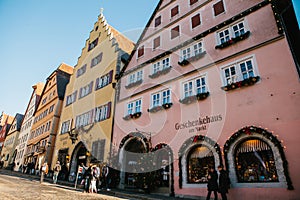 Rothenburg ob der Tauber, Germany, December 30, 2016: Christmas shopping and decorated houses in the city`s main square