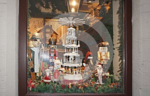 Rothenburg ob der Tauber, Germany - October 20, 2023: Wooden toy soldier Nutcracker in a red suit on the shop window.