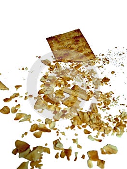 Cracker with Crumbs Scattered on Isolated White Background