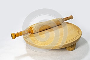 Roti or bread cutting and flatting board with rolling pin.