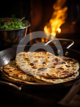 Roti or chapatti cooking in a non-stick frying pan in the kitchen
