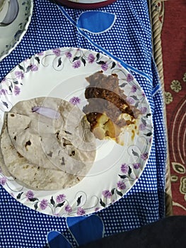 Roti with chicken at a dhaba . Delicious food . photo