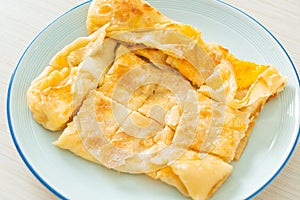 Roti with egg and sweetened condensed milk