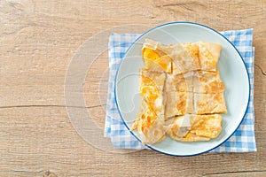 Roti with egg and sweetened condensed milk