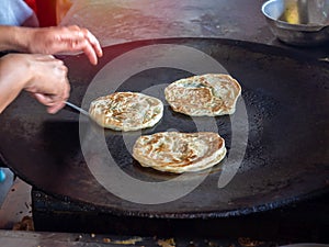 Roti Making, Roti and egg fried on the pan