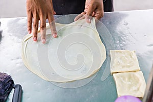 Roti Making, roti thresh flour by roti maker with oil. Indian traditional street food. Thai Pancake Banana And Egg .