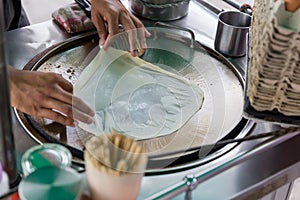 Roti Making, roti thresh flour by roti maker with oil. Indian traditional street food. Thai Pancake Banana And Egg .
