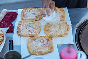 Roti Making, roti thresh flour by roti maker with oil. Indian traditional street food. Thai Pancake Banana And Egg . Thai Street F