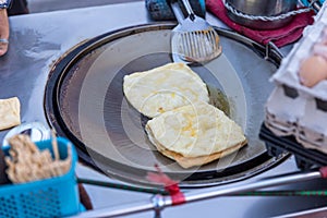 Roti Making, roti thresh flour by roti maker with oil. Indian traditional street food. Thai Pancake Banana And Egg . Thai Street F