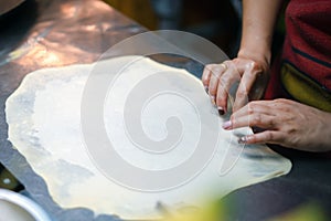 Roti Making, roti thresh flour by roti maker with oil.Thailand Street Food and Desserts. crispy pancake in Thailand