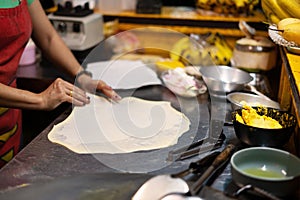 Roti Making, roti thresh flour by roti maker with oil.Thailand Street Food and Desserts. crispy pancake in Thailand