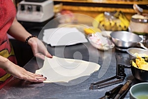 Roti Making, roti thresh flour by roti maker with oil.Thailand Street Food and Desserts. crispy pancake in Thailand