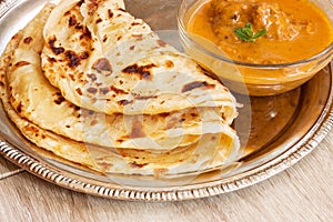 Roti parantha Porotta multi layered with curry photo