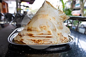 Roti Tisu or Tissue Bread is crunchy form of bread served at mamak restaurant in Malaysia