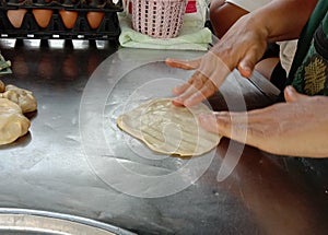 Roti is a type of food made from dough kneaded and then fried or grilled into thin strips.