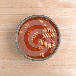 Rotini tomato soup in a bowl on table