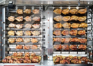 Rotisserie chickens spit roasted at a French street market