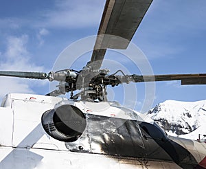 Rotor, base of the blades and the turbine nozzle did not exist in the helicopter rotor against the blue sky in the mountains